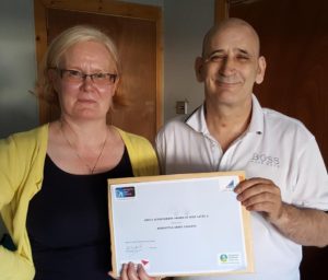 Tommy receiving his certificate